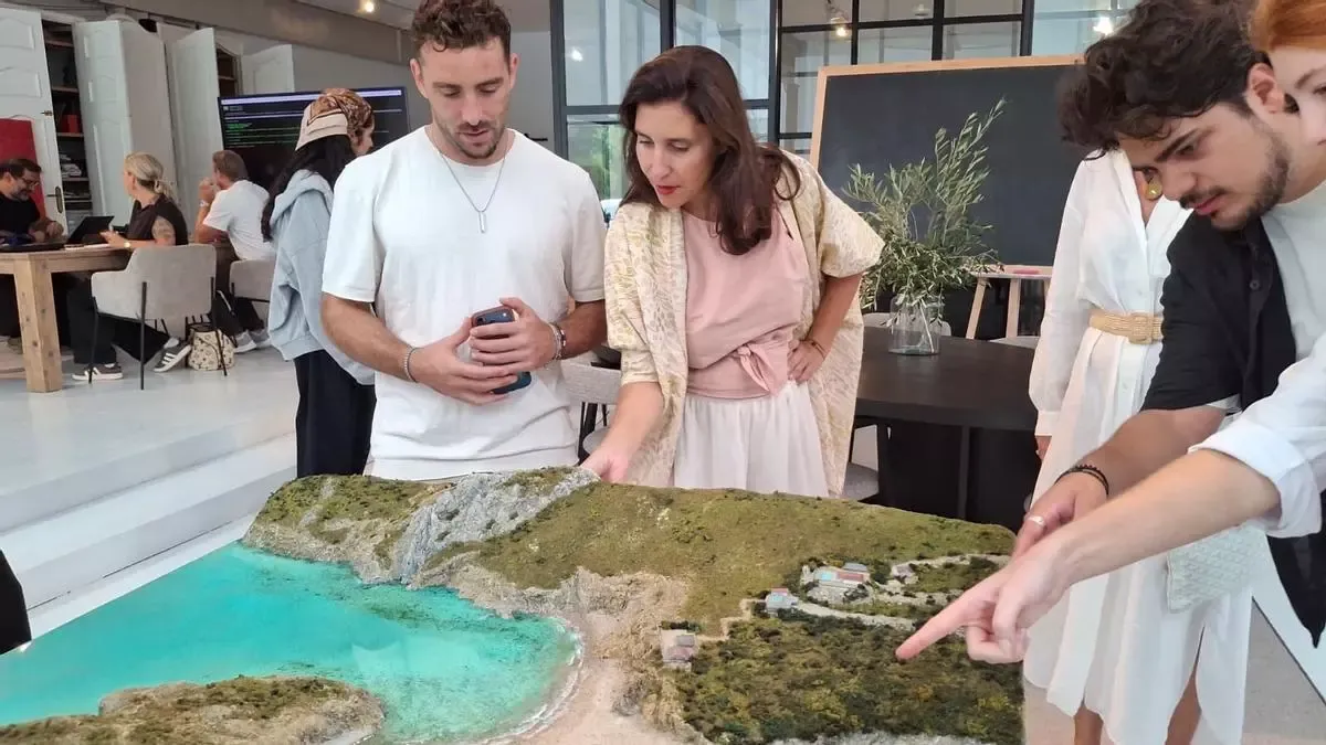 Jessica Bataille and guests looking at the relief model of La Granadella